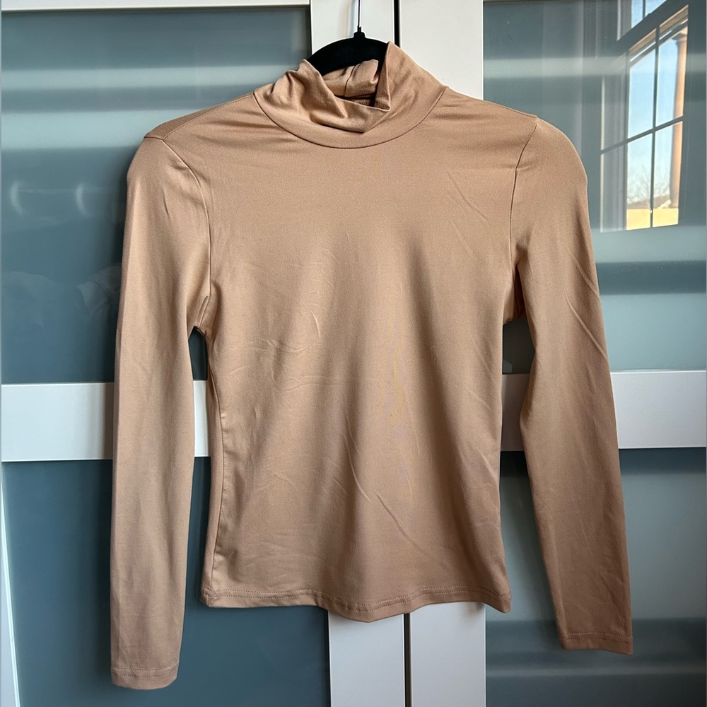 Small beige turtle neck, never worn before.